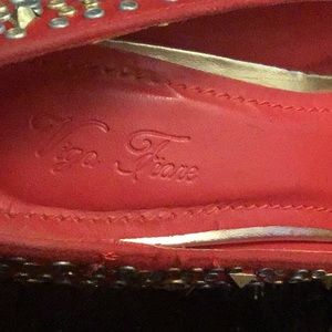 Studded peep toe platform heels.